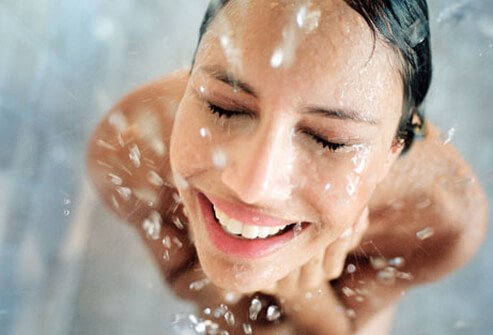 Photo of a woman taking a shower.
