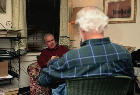 A man discusses his stroke experience in therapy.