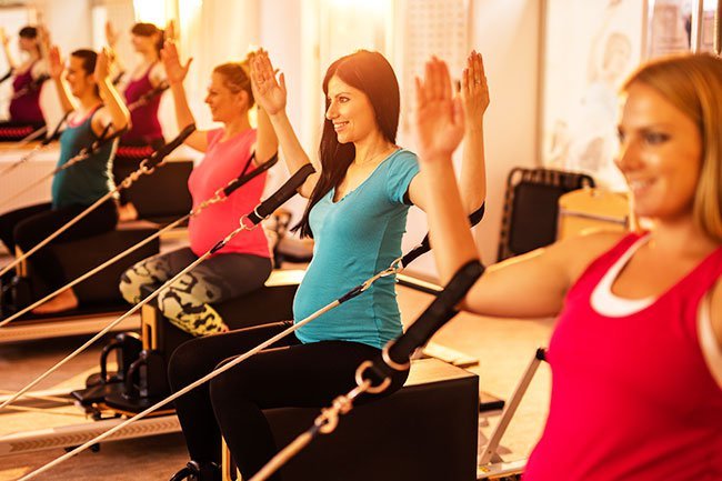 If you were exercising before pregnancy and during the first trimester, it's important to continue your activity in the second with exercise such as walking, yoga, swimming, and lifting weights..