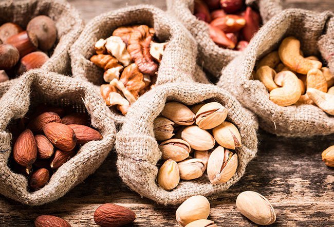 A nut allergy develops when the body's immune system becomes oversensitive to a particular protein in a nut. Nuts that are the worst for allergies include peanuts, walnuts, pecans, almonds, Brazil nuts and pine nuts.