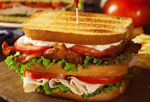 Even with lean turkey or chicken, they can serve up a ton of calories and a whole day’s worth of saturated fat. Where is it all hiding?