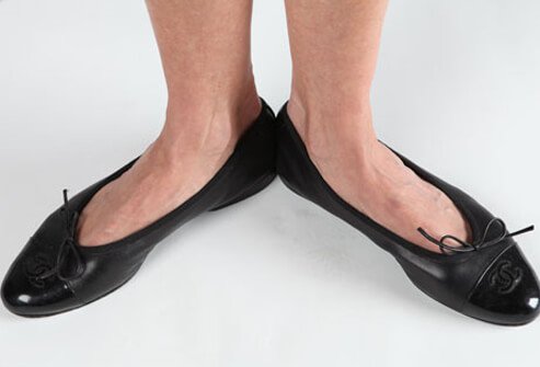 Photo of woman wearing ballet flats.